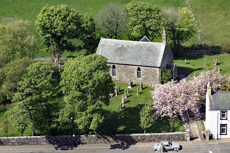An aerial view of Craigie Village and Church, by Kilmarnock, Ayrshire