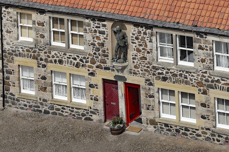 An aerial view of The Statue of Robinson Crusoe (Alexander Selkirk) in Lower Largo. Fife